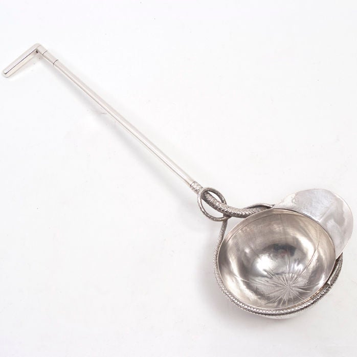 German grade (800) silver punch ladle in the form of a riding crop and cap, early 20th Century, bearing makers mark and retailers mark for F.Schade, Ross str 27 (Berlin).