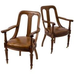 A Pair of Faded Mahogany Open Armchairs