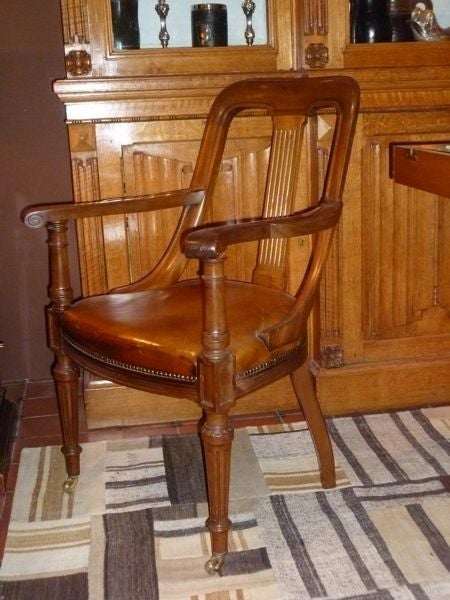 A Pair of Faded Mahogany Open Armchairs