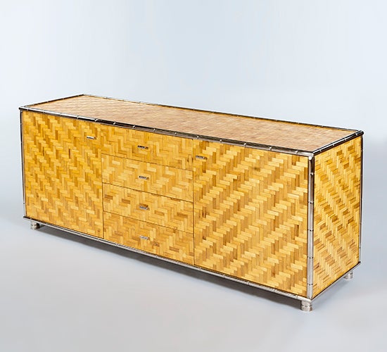 Weave sideboard with chrome trim. The finish is in woven bamboo with the chrome trim mimicking bamboo.

Please note that we have two of these sideboards which are almost identical apart from minor pattern variations. Images of the second cabinet