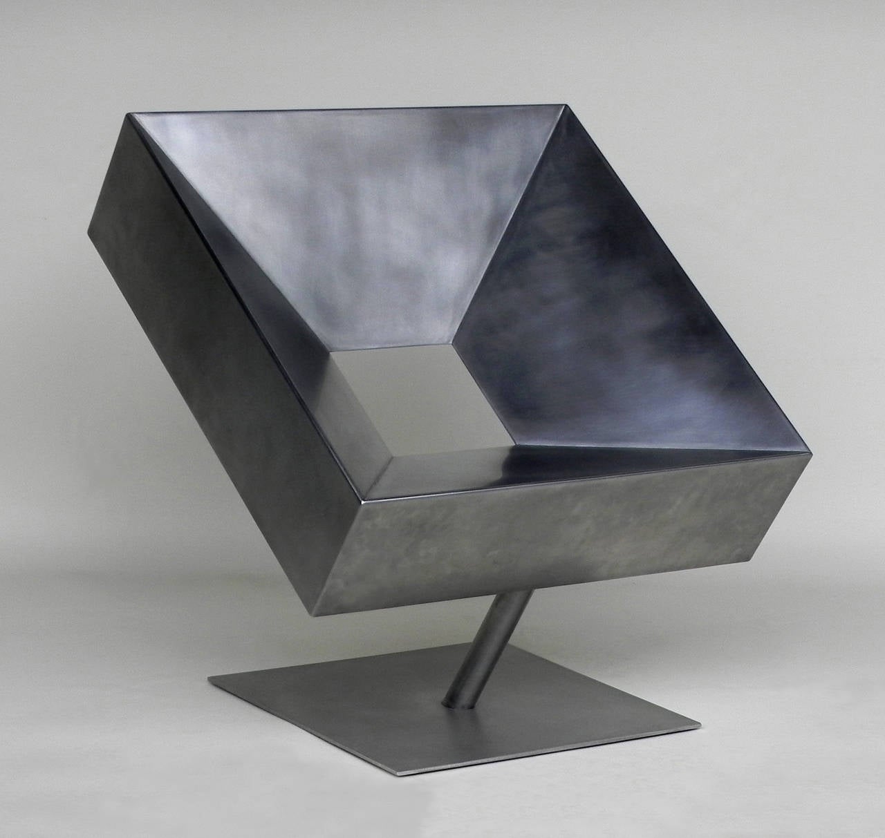 Brutalist chair in steel with a smooth waxed finish. Stephane Ducatteau's pieces are sculptural and yet ergonomic and functional. He uses a range of metal treatments to achieve a glossy soft finish.

Please note that this particular Cadre chair has
