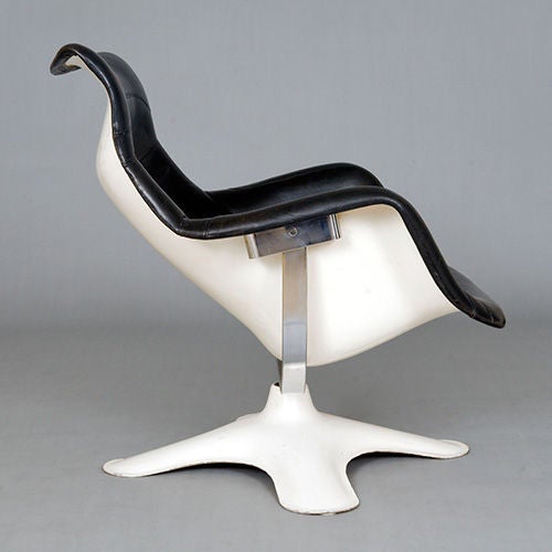 `Karuselli` swivel chair by Yrjo Kukkapuro, Finland, c1964. White moulded polyester reinforced fibreglass shell with black leather.<br />
<br />
The story behind this chair is that Kukkapuro got the idea for the design after playing in the snow