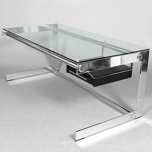"Bureau Airborne", chrome and glass desk by Gilles Bouchez (b. France, 1940). The simple, clean lines are what first attracted our attention to this beautifully proportioned desk.