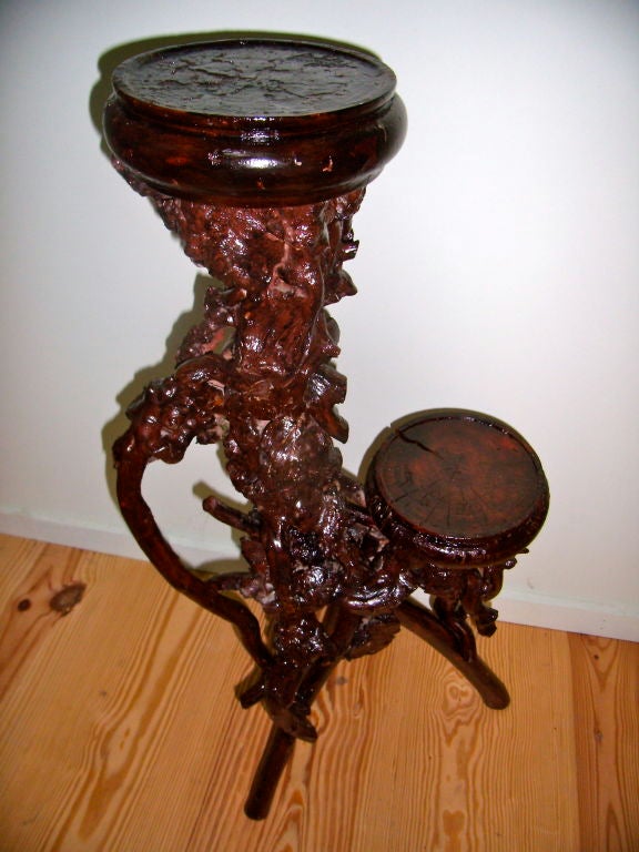 pair of burl wood root stands. One stand has 2 arms and the other stand has 3 arms<br />
originally used as plants stands they make excellent side tables
