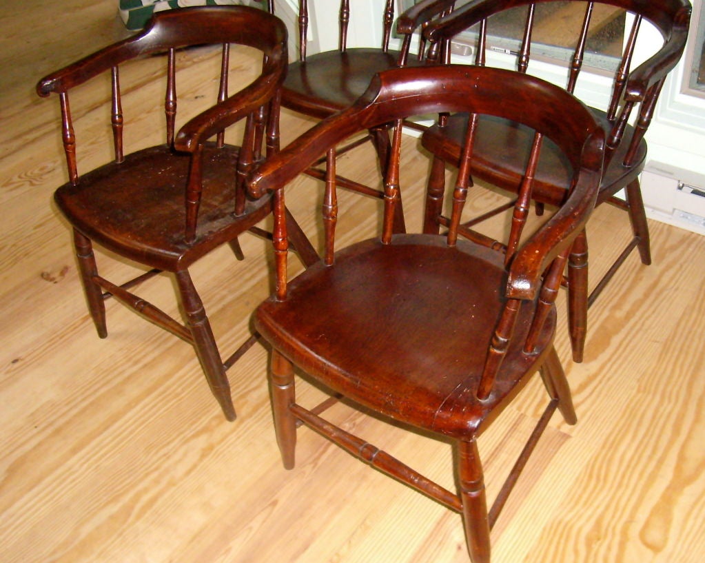 rare set of 8 windsor captain's chairs in old painted finish.