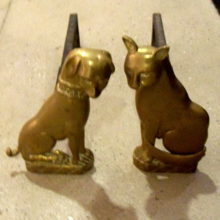 A Pair of Brass Dog and Cat Andirons