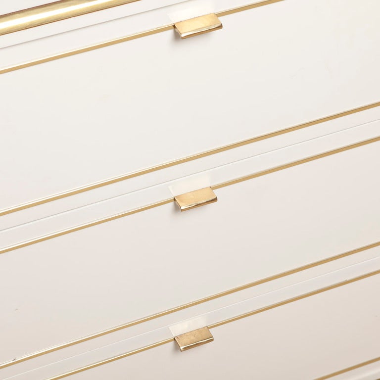 A Six Drawer White Lacquer and Brass Commode designed for John Stuart New York 1970s Stamped