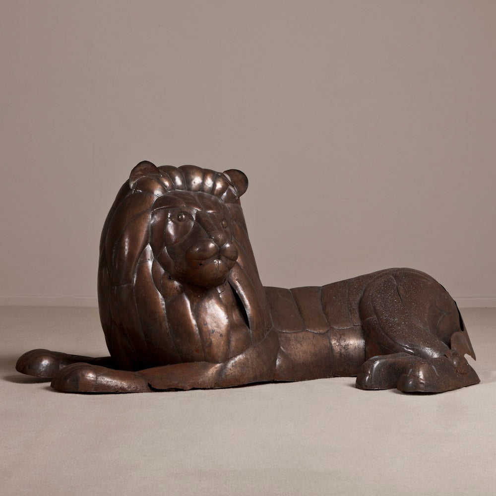 A Large Brass Recumbent Lion in the Manner of Bustamante