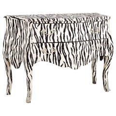 A Faux Zebra Skin Wrapped Two Drawer Bombe Commode 1970s