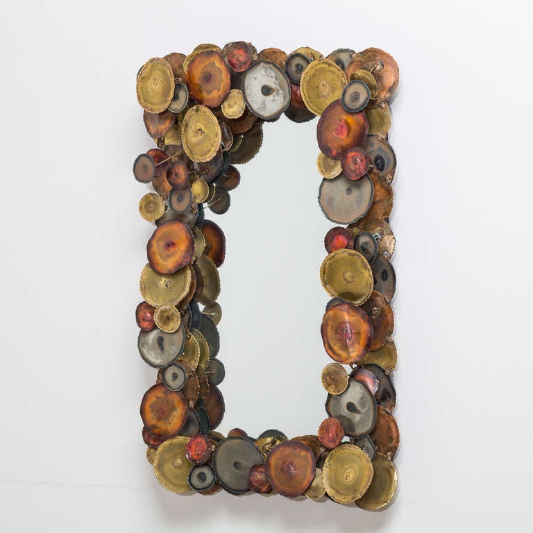 A Silas Seandel style metal framed sculptural mirror 1970s.