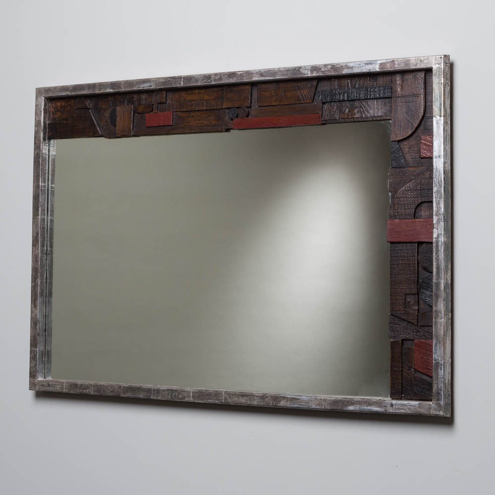 A brutal part silver leafed lane designed mirror from their Peublo collection, USA, 1960s

Lane was founded in 1912 by John Lane and his sons in Altavista, Virginia and started out making chests. They are defined by their often geometric and block