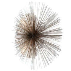 A Large Starburst Metal Wall Sculpture by Curtis Jere 1970s
