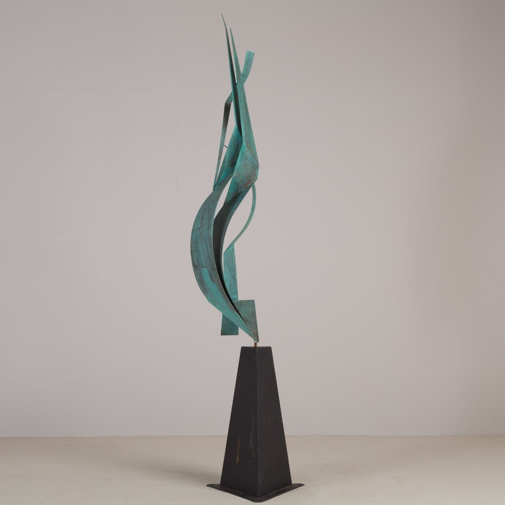 A patinated metal floor standing sculpture by Curtis Jere signed and dated 2002.
