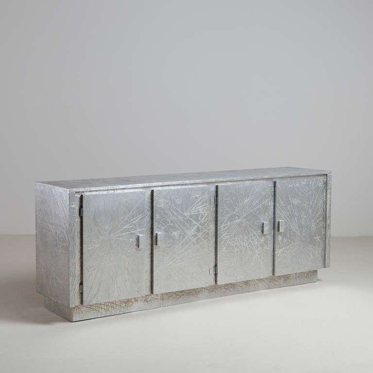 An Embossed Aluminium Wrapped Four Door Cabinet by Arenson of West Palm Beach USA 1975 stamped and signed