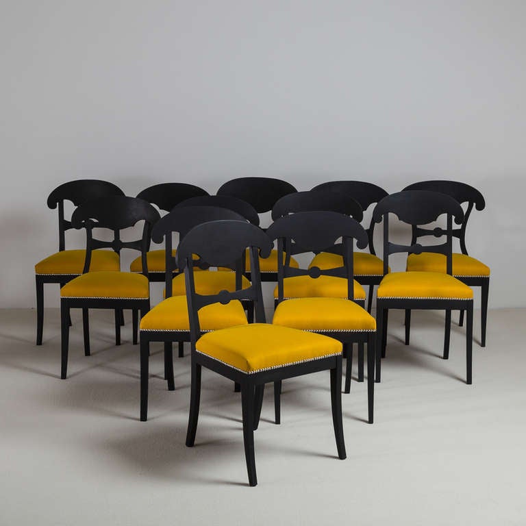 A Set of Sixteen Ebonised Swedish Empire Dining Chairs with Napoleon Hats circa 1820