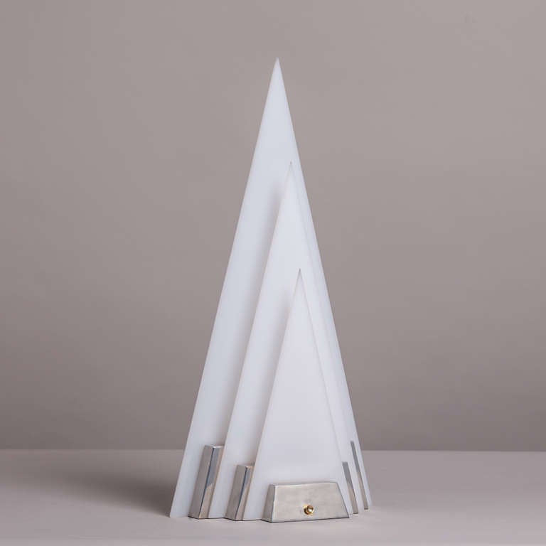 A single pyramid shaped aluminium and acrylic sculptural table lamp, late 1970s.
