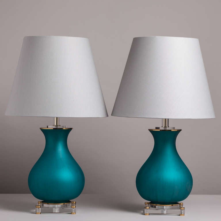 An Unusual Pair of Teal Blue Glass Table Lamps Mounted on Lucite Bases with Brass Detail 1960s