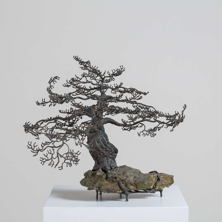 A Superb Table Sculpture in Bronze of a Bonsai Oak Tree in Winter. The Roots Covering a Rocky Base of Fools Gold Mid 1960s

Bonsai started in Japan in the 6th century. Bonsai or the art of Pen Jung translates to tray planting. Originally, they were