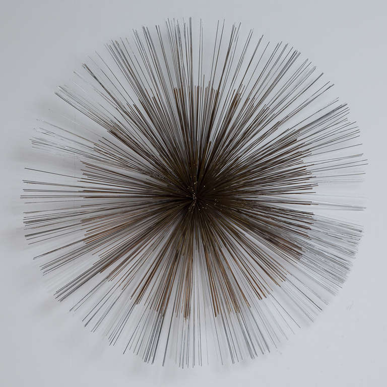 A Large Three Toned Starburst Wall Sculpture by Curtis Jere USA 1970s