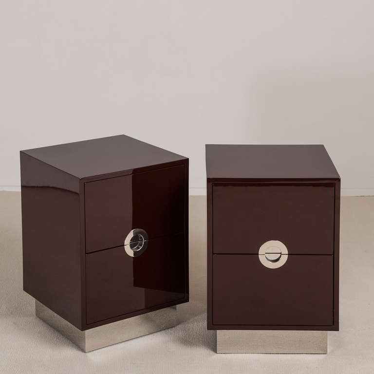 A Standard Pair of Mocha Lacquered Porthole Bedside Cabinets on Steel Bases by Talisman Bespoke.  
 
This 1970s inspired design is available in a wide range of lacquer colours (RAL/paint colours can be specified) with either brass or steel