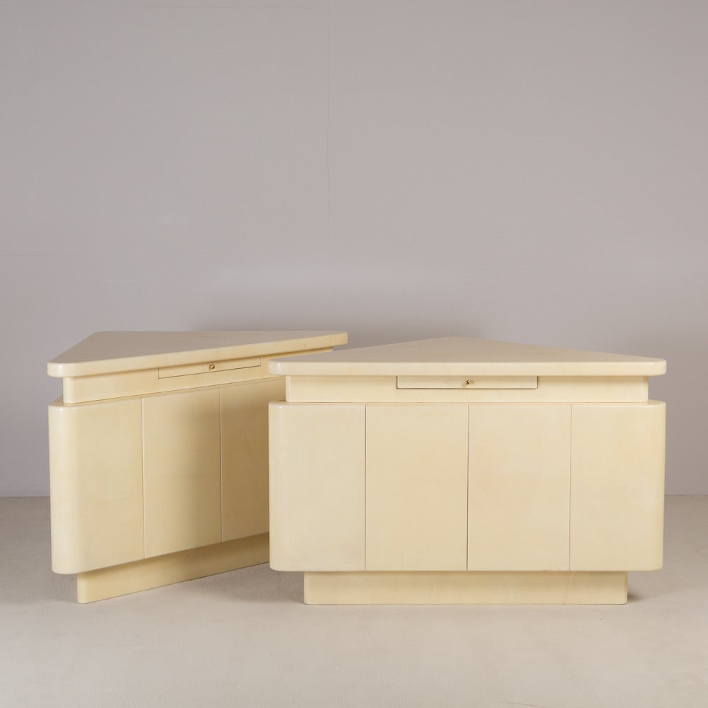 A Large Pair of Goatskin Lacquered Corner Cabinets/Bars with concealed drawers and serving drawers 1980s