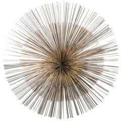 A Large Three Tone Starburst Wall Sculpture by Curtis Jere