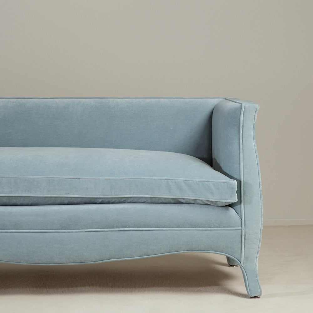 A standard high back French style powder blue velvet upholstered sofa by Talisman Bespoke. 

Unusual and elegant, this signature Talisman Bespoke sofa is inspired by a unique French, 20th century design. This sofa is available in a variety of