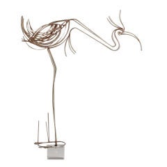 A Curtis Jere Metal Standing Bird Sculpture