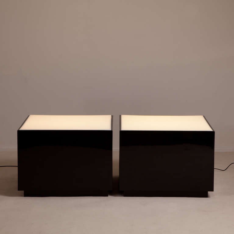 A pair of square black lacquer lucite lightbox tables with opaque white tops, 1970s, Talisman edition.
