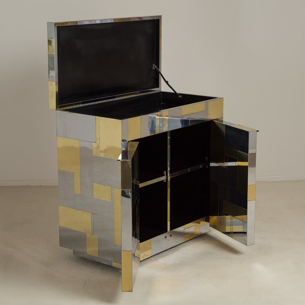A freestanding brass and chrome two-door bar cabinet designed by Paul Evans for Directional's Cityscape collection, 1970s.