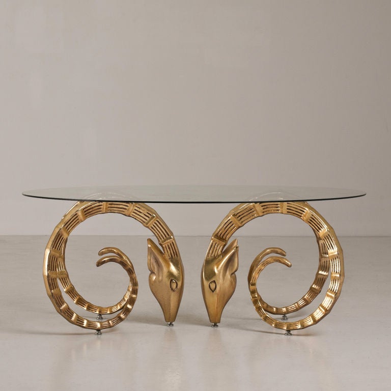 A Pair of Gold Sprayed Metal Rams Head Coffee Table Base