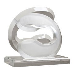 A Lucite Swirl Shaped Table Sculpture signed Michael Ogius