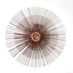 A Starburst Metal Wall Sculpture