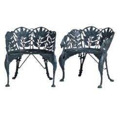 A Curved Cast Iron Pair of Chairs in Laurel Leaf Pattern
