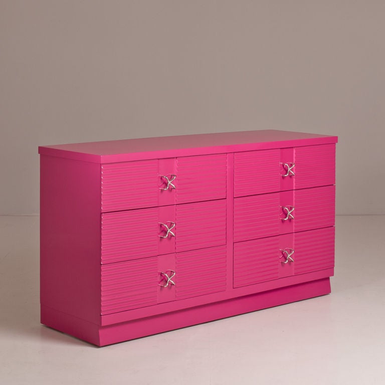 A 1950s Designed Bright Pink Lacquered Six Drawer Commode with Nickel Plated Handles in the manner of  Paul Frankl