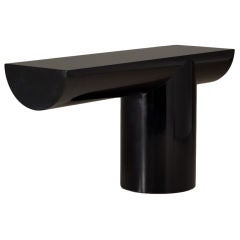 An Asymmetrical Black Lacquered Cantilevered Console Table