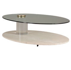 A Travertine and Lucite Oval Coffee Table by Lion in Frost