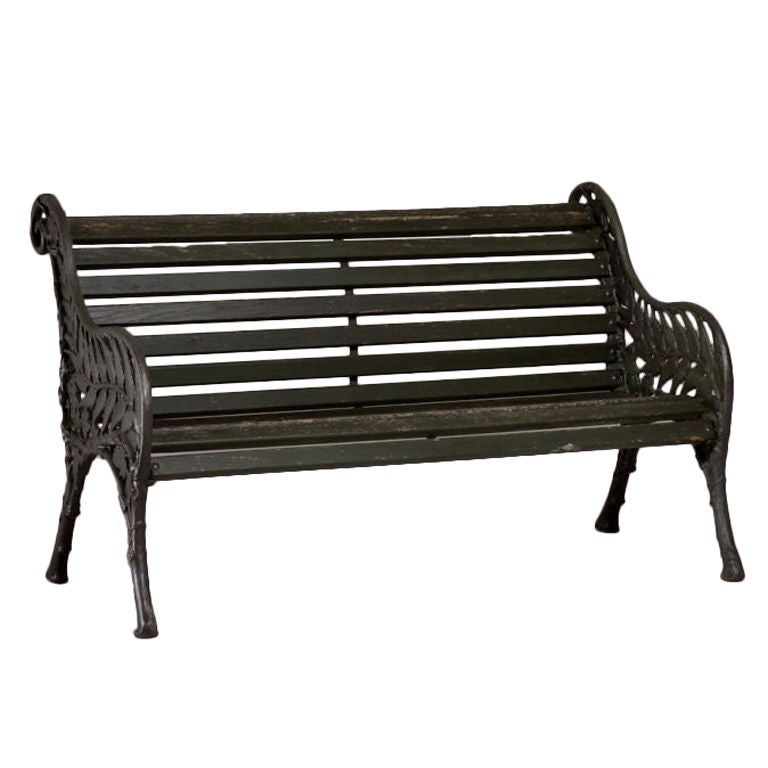 A Victorian Garden Bench with Cast Iron Ends in a Fern Pattern