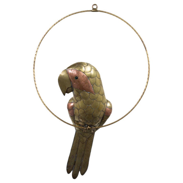 A Brass and Copper Bustamante Parrot on a Circular Stand