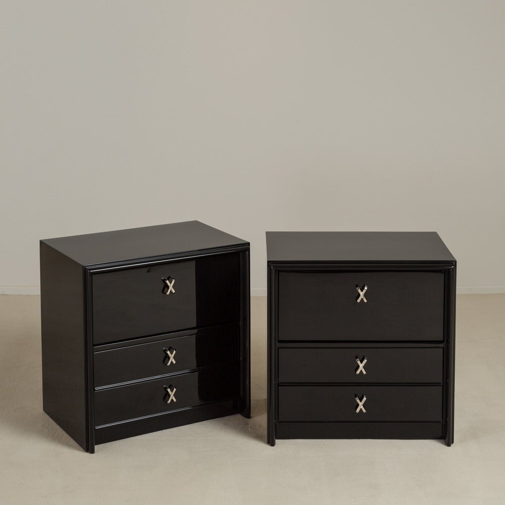 A Pair of Jet Black Lacquered Paul Frankl Side Cabinets designed for Johnson Furniture USA 1950s stamped, Talisman Edition

Top drawer is in fact a hingled drop down shelf