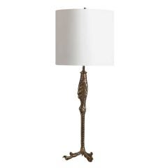 A Single Brass Bird Leg Lamp