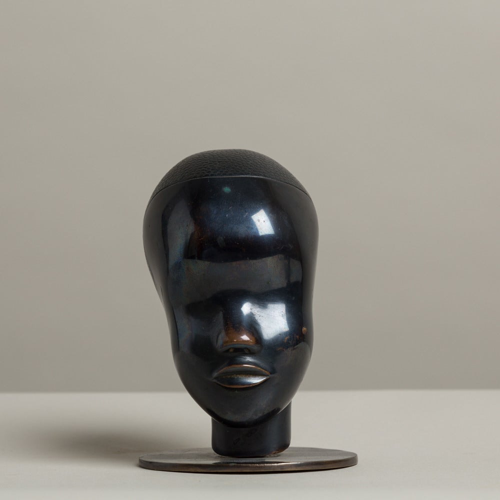 A Bronze Head in the manner Hagenauer on a Brass Plate Stand

Part of a Collection all available to purchase individually
