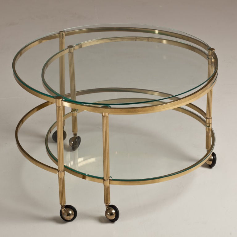American A Two Tiered, Brass Framed Swivel Extending Coffee Table