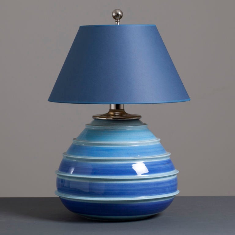 Single large Italian glazed ceramic and nickel plated ringed table lamp in blues and duck egg tones accompanied with a blue lamp shade. 1960s.