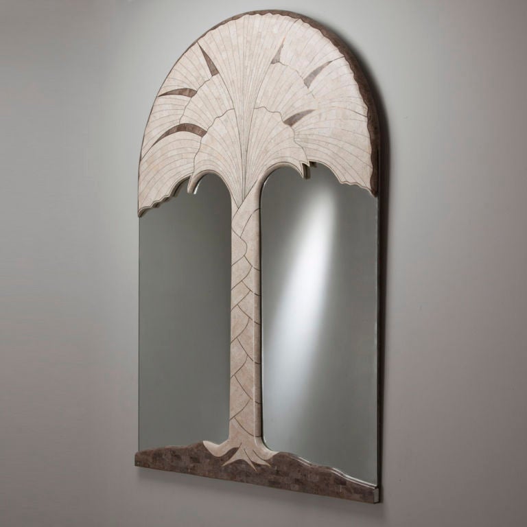 A matched pair of Maitland-Smith designed tessellated stone and brass inlay framed mirrors depicting each a large palm tree, 1980s.

Only one of the matched pair illustrated in visual 

Prices include 20% VAT which is removed for items shipped