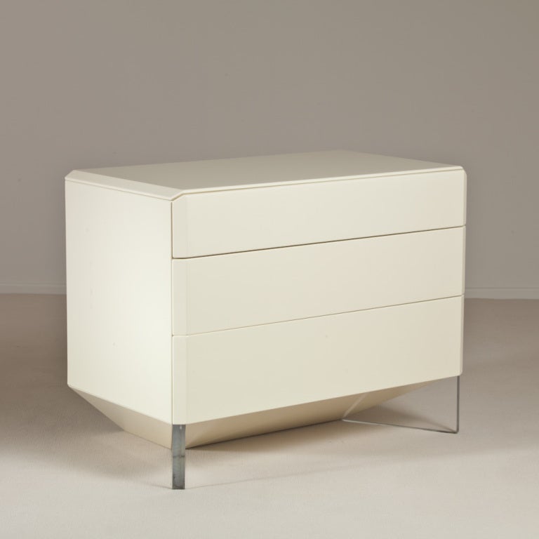Three-drawer lemon lacquered commode on an interesting tapered inward base with Lucite supporting, designed by Rougier, Canada, late 1970s.

Although there is little documented about the Canadian designer Roger Rougier we know that their designs