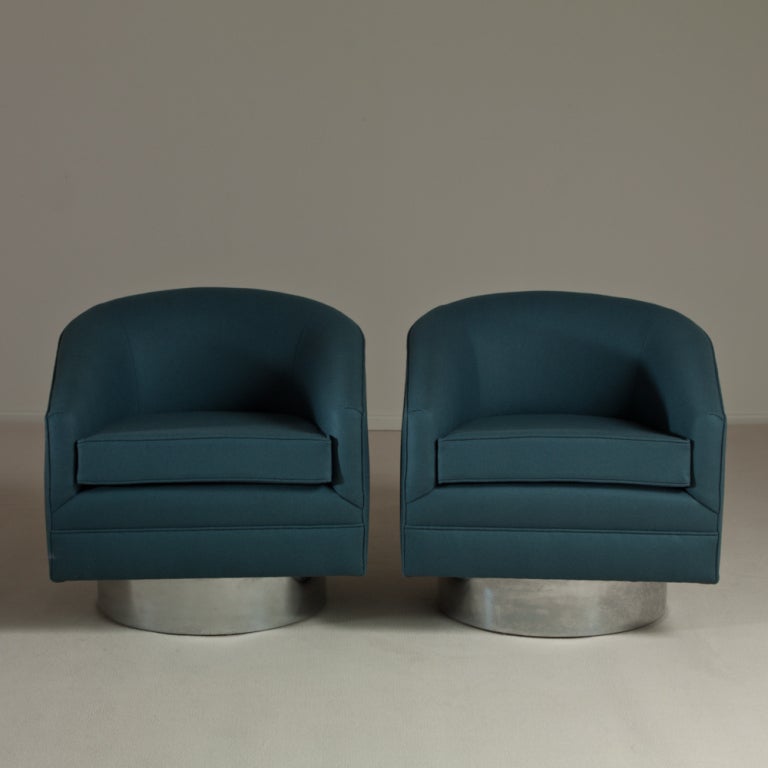 A Pair of Blue Upholstered Swivel Chairs on a Chrome Base USA 1960s