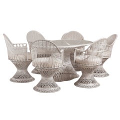 A Large Spun Aluminium Oval Dining Table and Six Armchairs 1960s