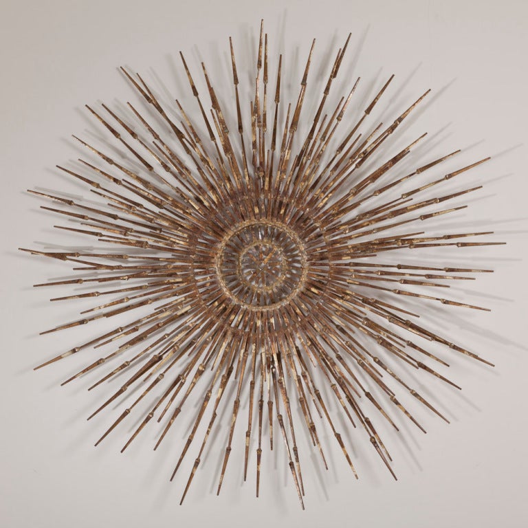 A Metal Sunburst Wall Sculpture by Marc Weinstein USA 1970s