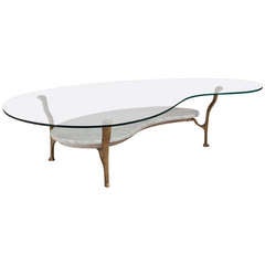 A Biomorphic Shaped Glass and Marble Tiered Coffee Table